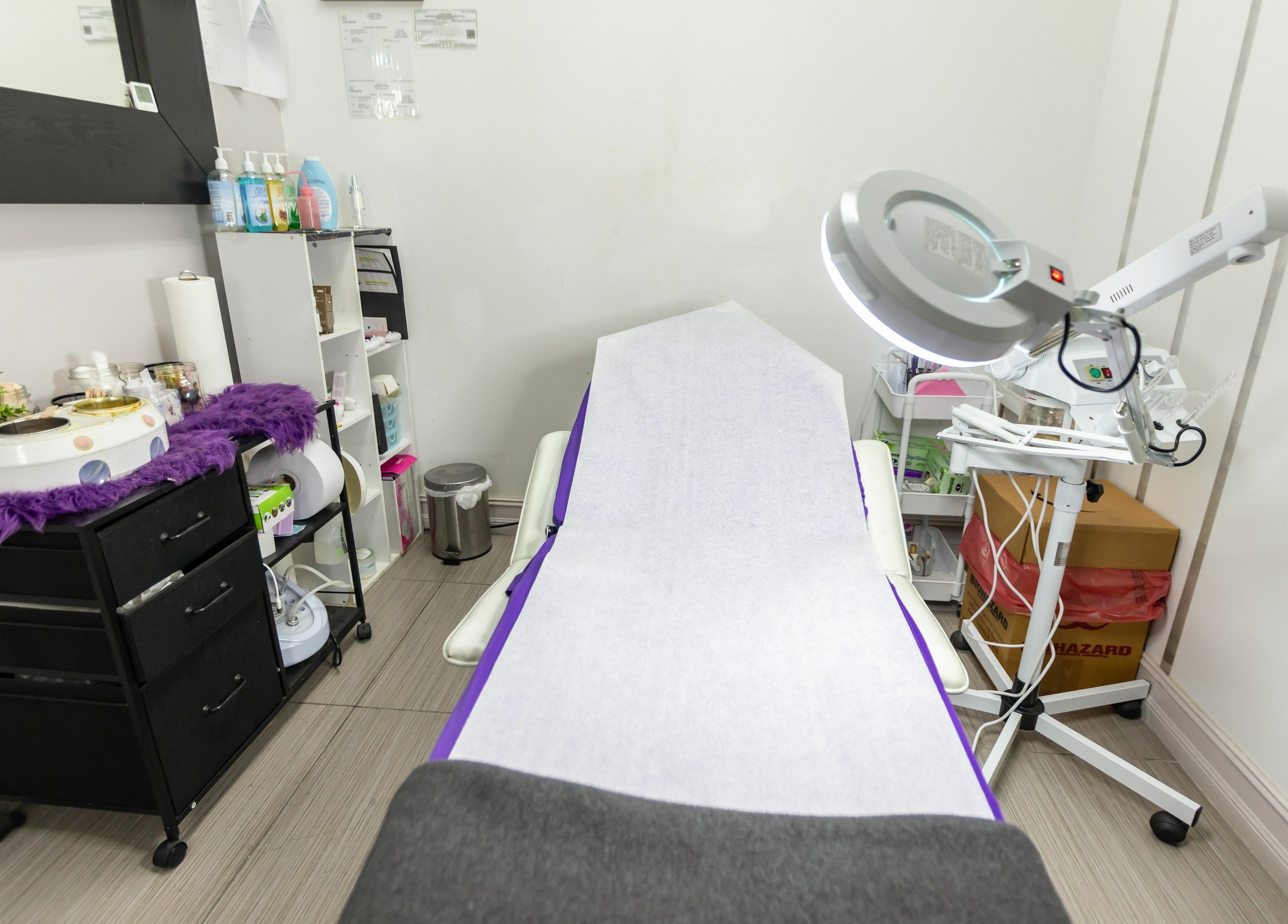 Relaxing treatment room at Tips & Dips Nail Studio in Doral, Florida, US featuring comfortable setup.
