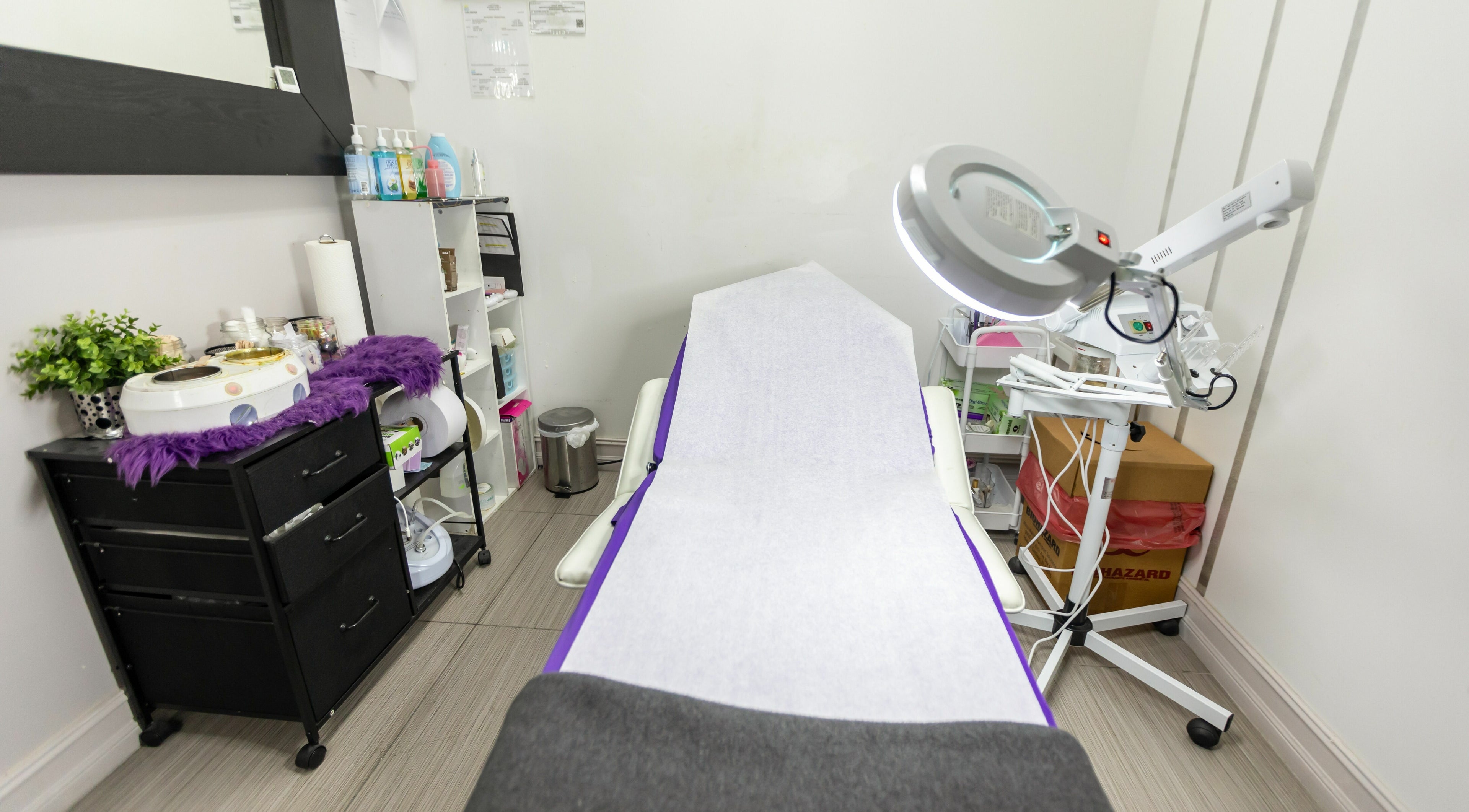 Relaxing treatment room at Tips & Dips Nail Studio in Doral, Florida, US featuring comfortable setup.