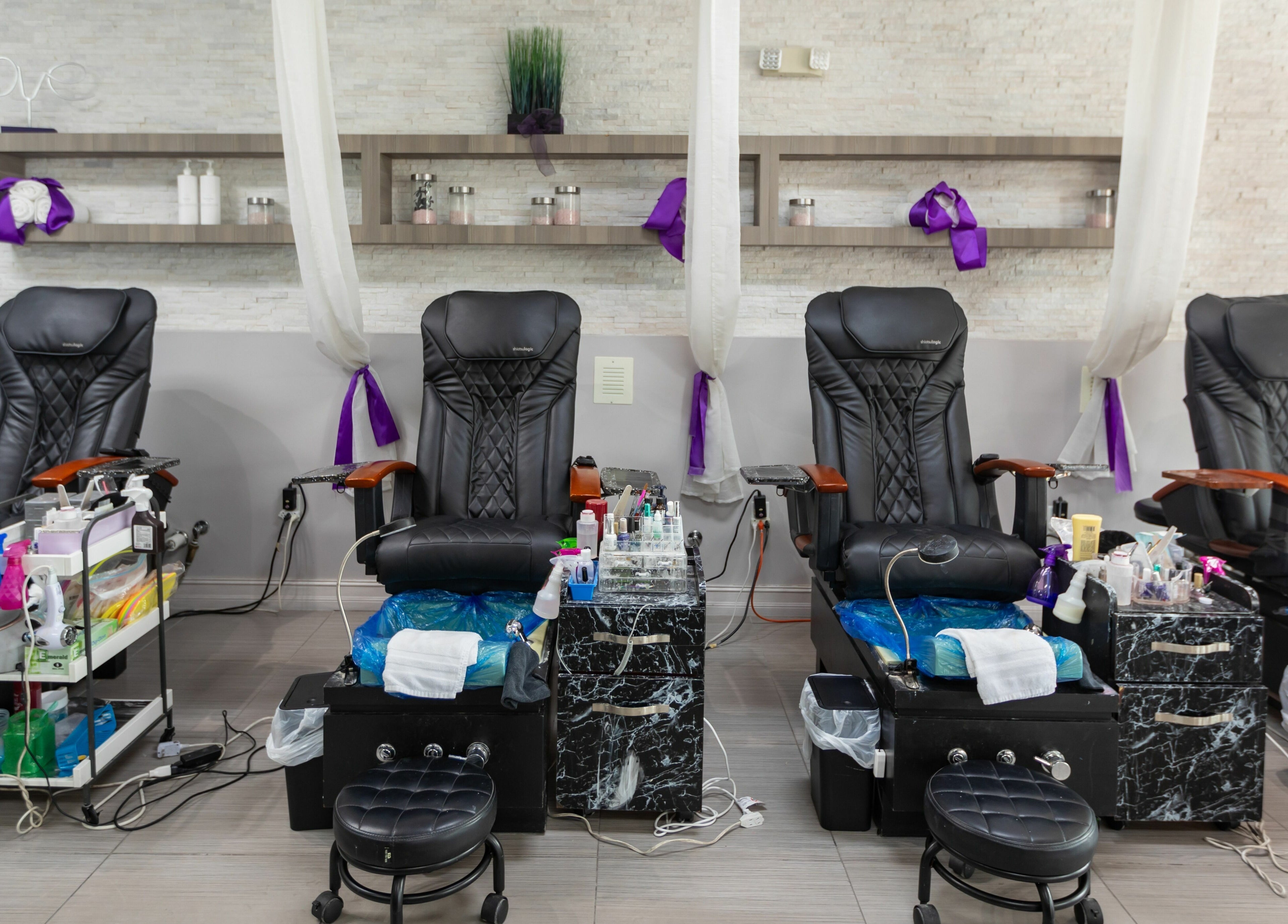 Luxurious pedicure chairs at Tips & Dips Nail Studio in Doral, Florida, US, offering top-notch beauty services.