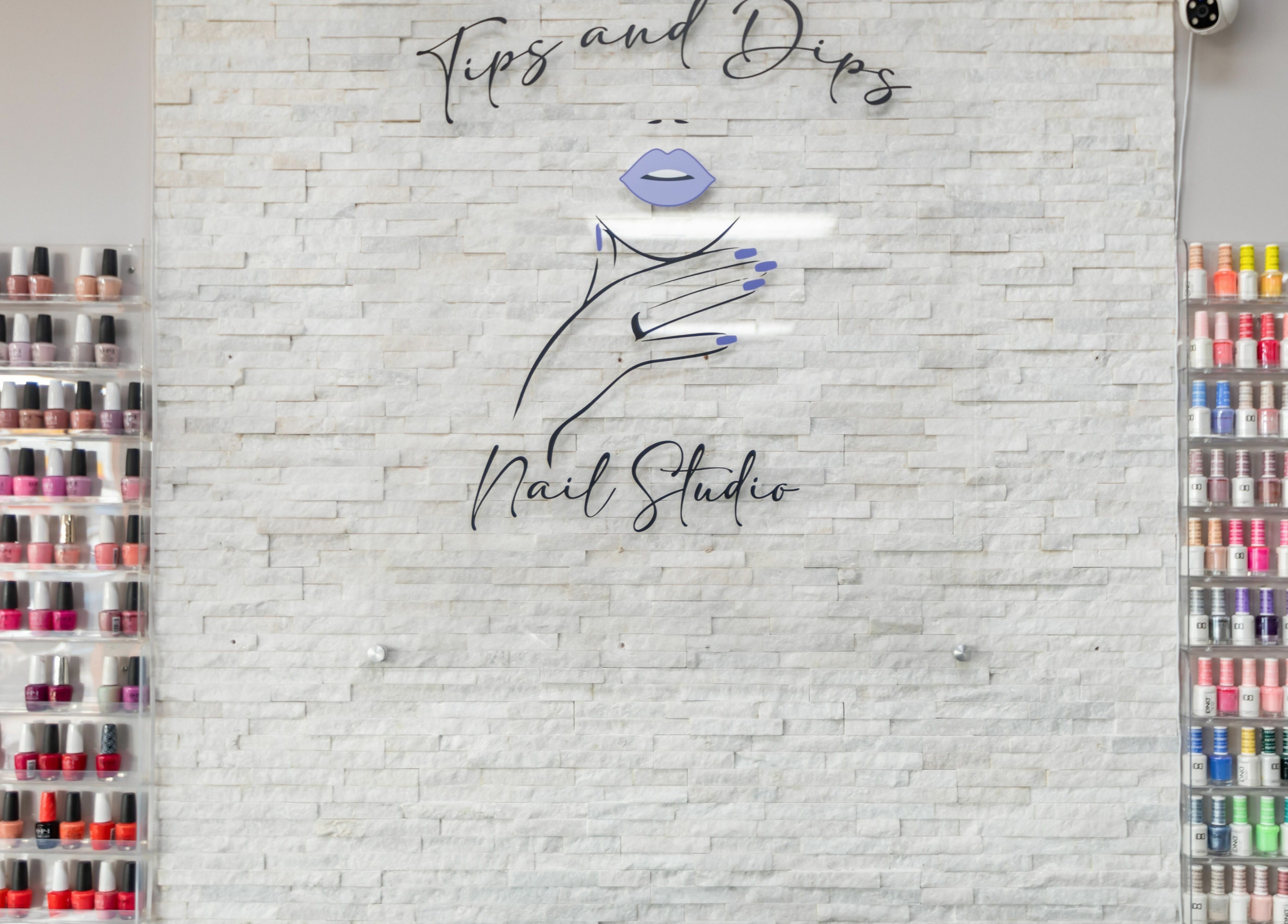 Colorful nail polish display at Tips & Dips Nail Studio, Doral, Florida, US, showcasing a variety of shades.