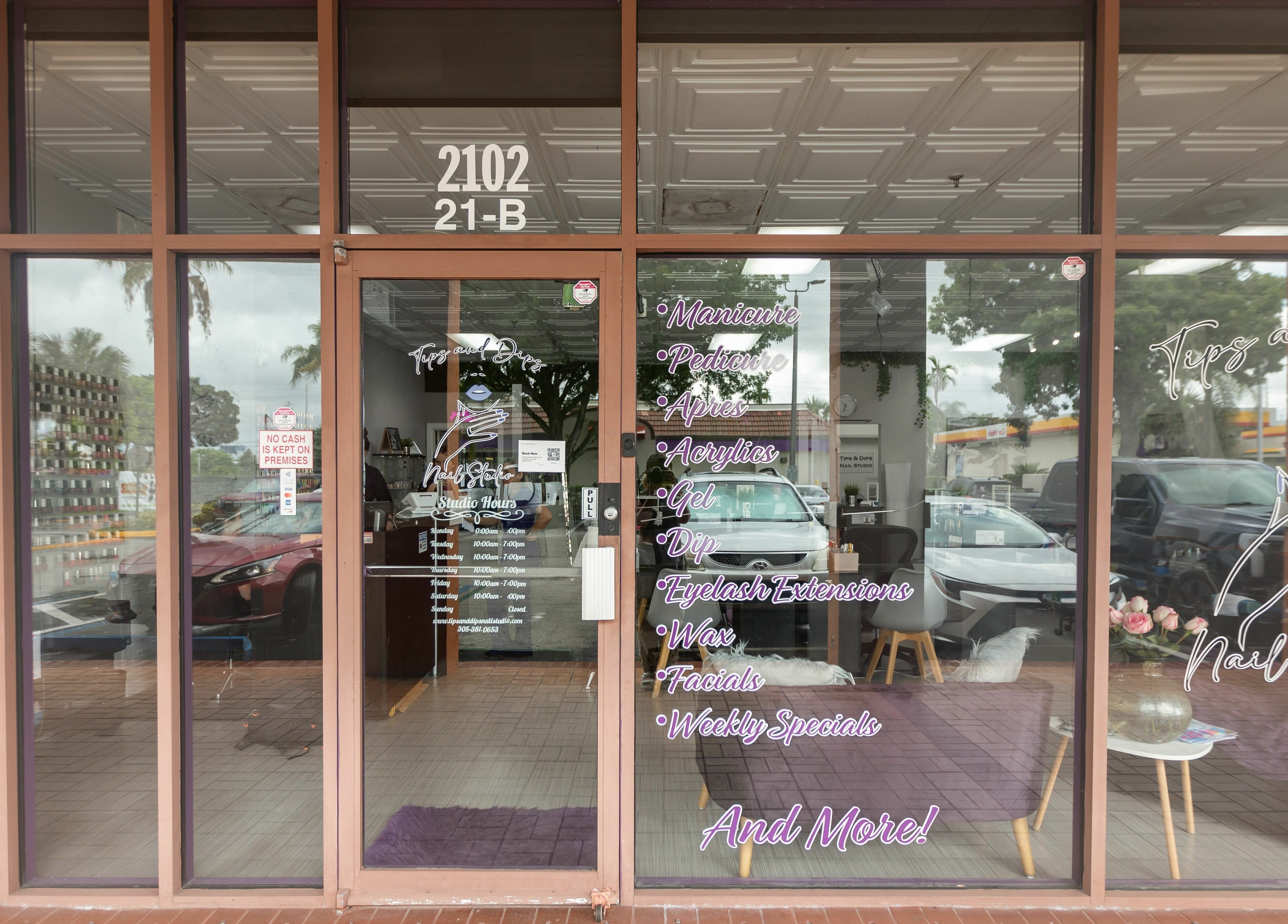Front of Tips & Dips Nail Studio in Doral, Florida, US, showcasing stylish glass entrance.