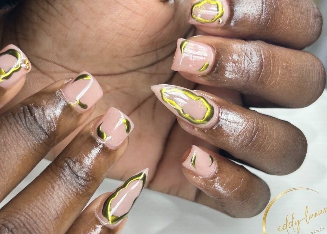 Elegant nail art design at Eddy_luxury, Portmore, St. Catherine Parish, JM, showcasing unique glossy accents.