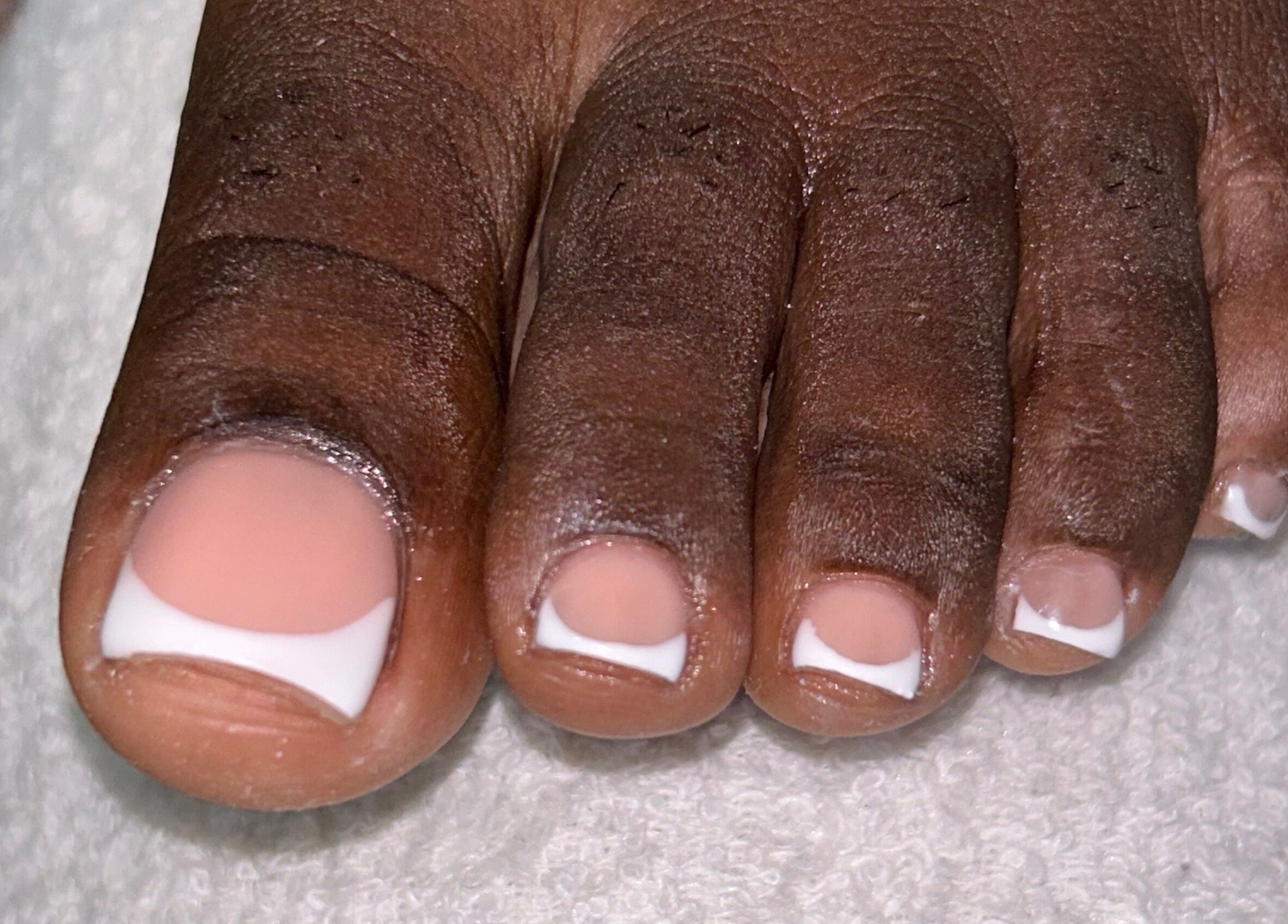 Elegant French pedicure at Eddy_luxury, Portmore, St. Catherine Parish, JM. Experience unmatched toe nail care.