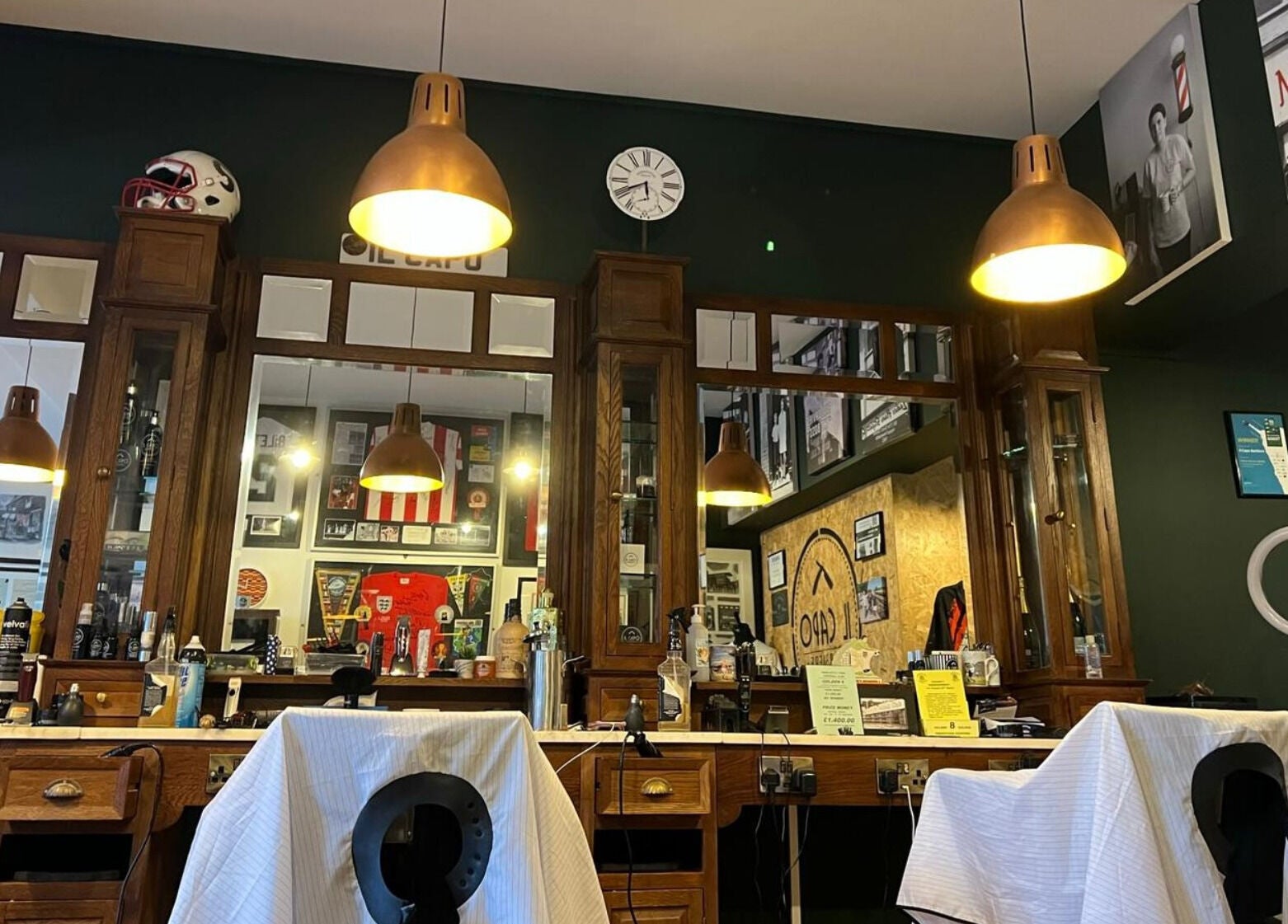 Elegant interior of Il Capo Barbiere in Newcastle-under-Lyme, England, GB showcasing vintage barber chairs.