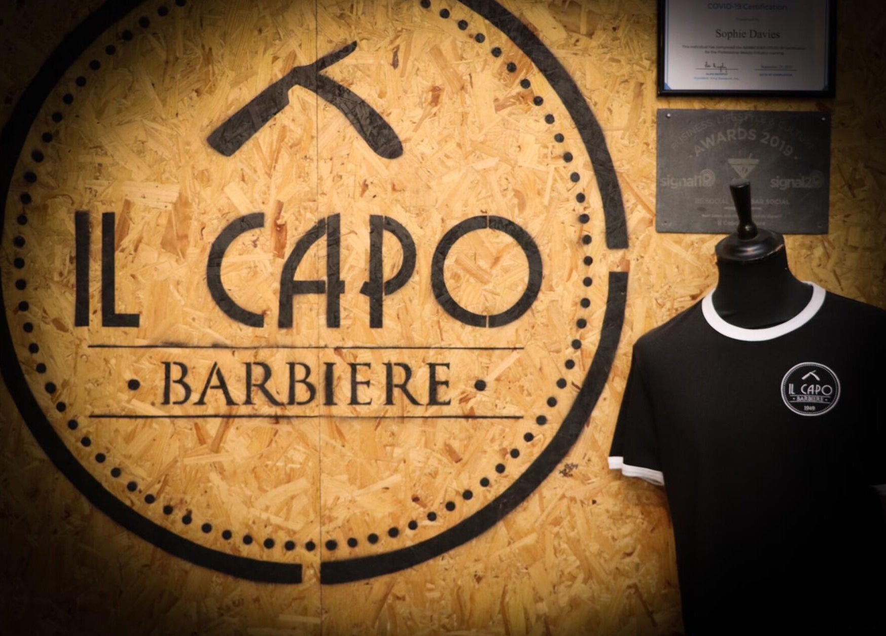 Il Capo Barbiere wall logo and shirt at Newcastle-under-Lyme, England, GB.