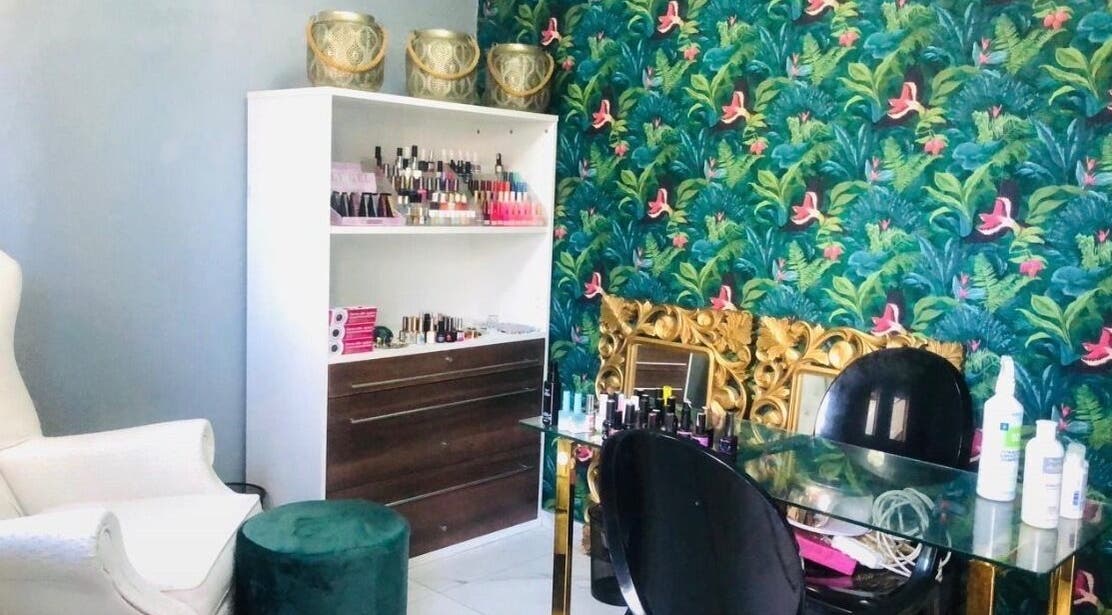 Elegant nail salon setup at Zash Beauty, Johannesburg, Gauteng, ZA with floral wallpaper and plush seating.