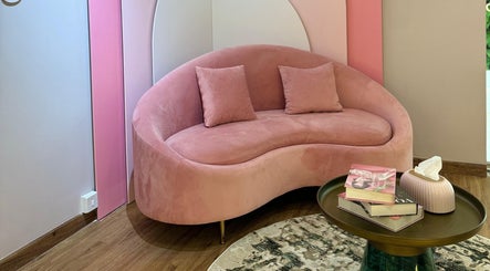 Elegant pink couch and table at SHAPE ON, Dubai, Dubai, AE, enhancing the stylish beauty ambiance.
