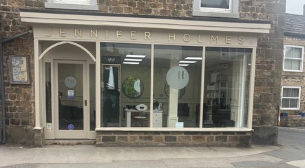 Front view of Kim A Hair salon located in Masham, England, GB, showcasing its stylish storefront.