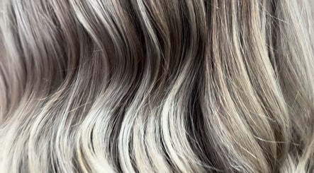 Close-up of shiny, highlighted hair at Kim A Hair, Masham, England, GB. Perfect blend of tones and smooth texture.