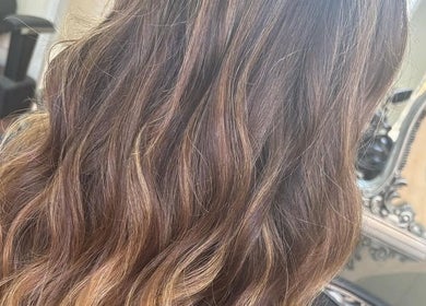 Lustrous waves hairstyle at Kim A Hair, Masham, England, GB, highlighting expert styling and care.