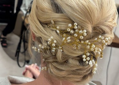 Elegant bridal updo with pearls at Kim A Hair in Masham, England, GB, showcasing intricate styling.
