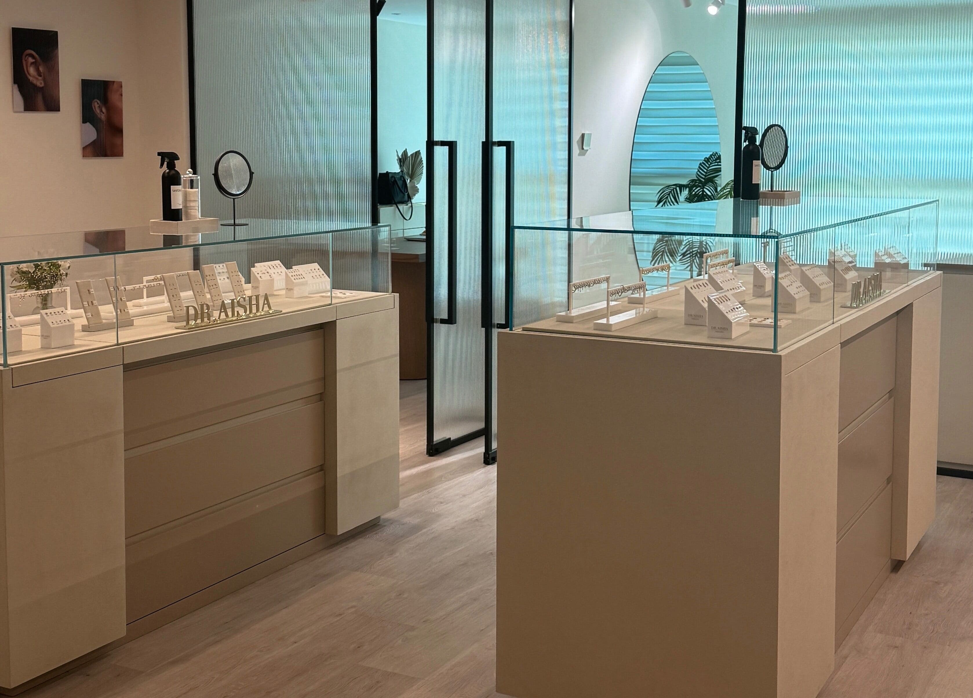 Modern piercing showroom at Dr. Aisha Piercing, Dubai, Dubai, AE, showcasing elegant jewelry displays.