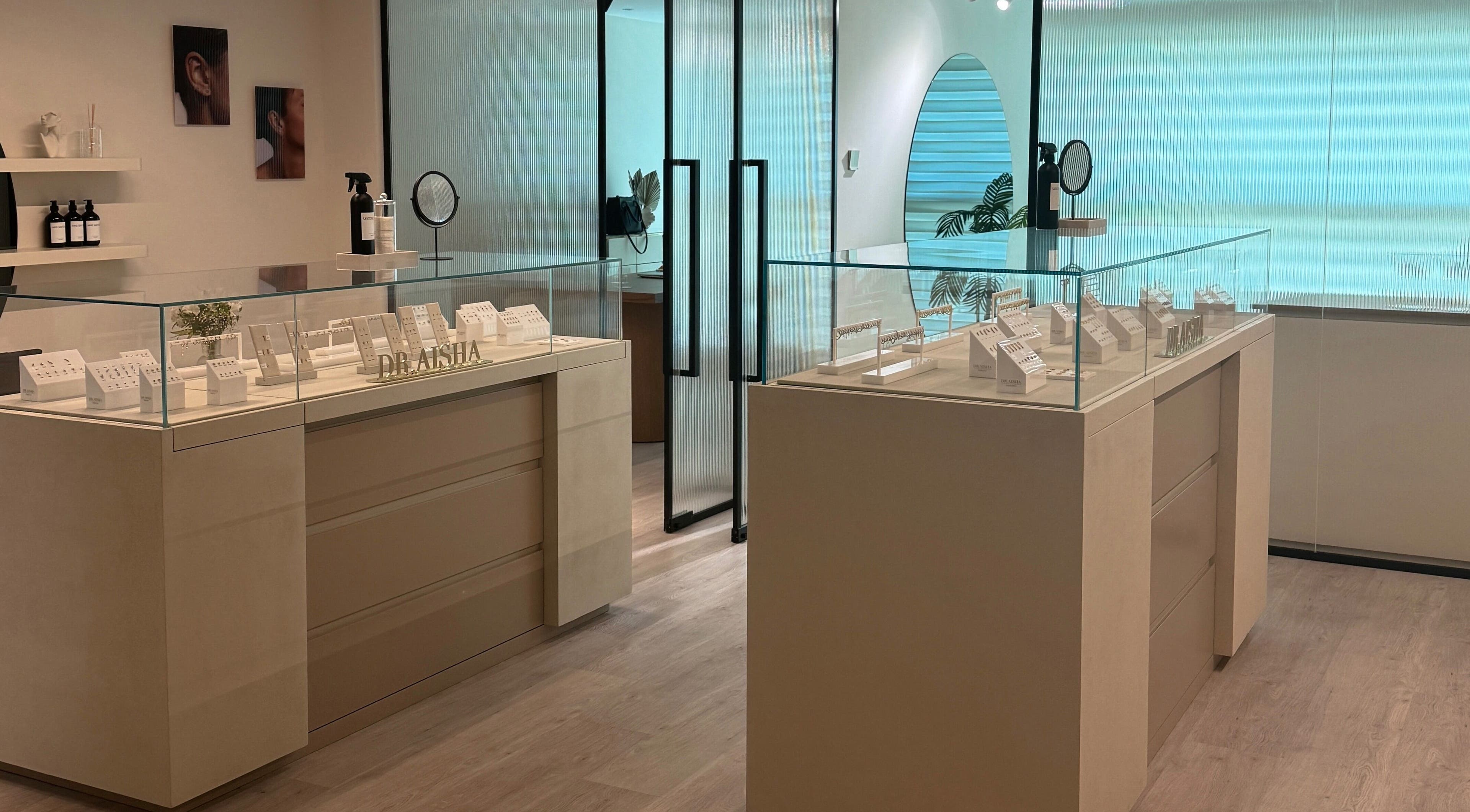 Modern piercing showroom at Dr. Aisha Piercing, Dubai, Dubai, AE, showcasing elegant jewelry displays.