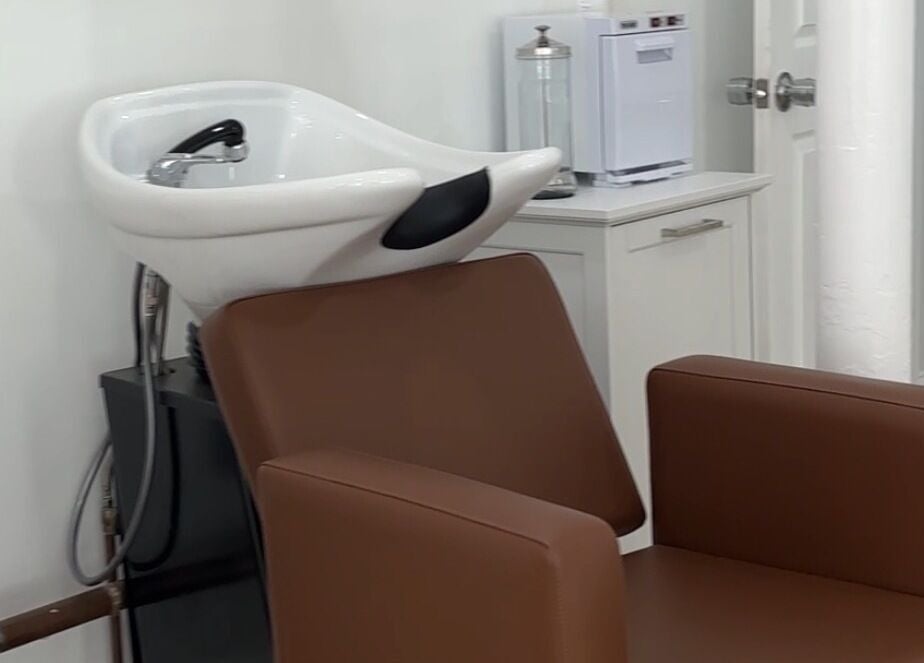 Chic salon wash station at Prado Beauty, Worcester, Massachusetts, US, featuring sleek design and comfort.