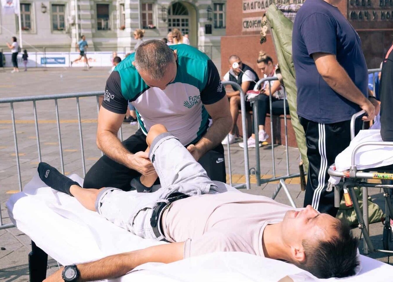 Physio Spa- Fizio Spa therapist in Zrenjanin, Vojvodina, RS performing a leg massage outdoors.