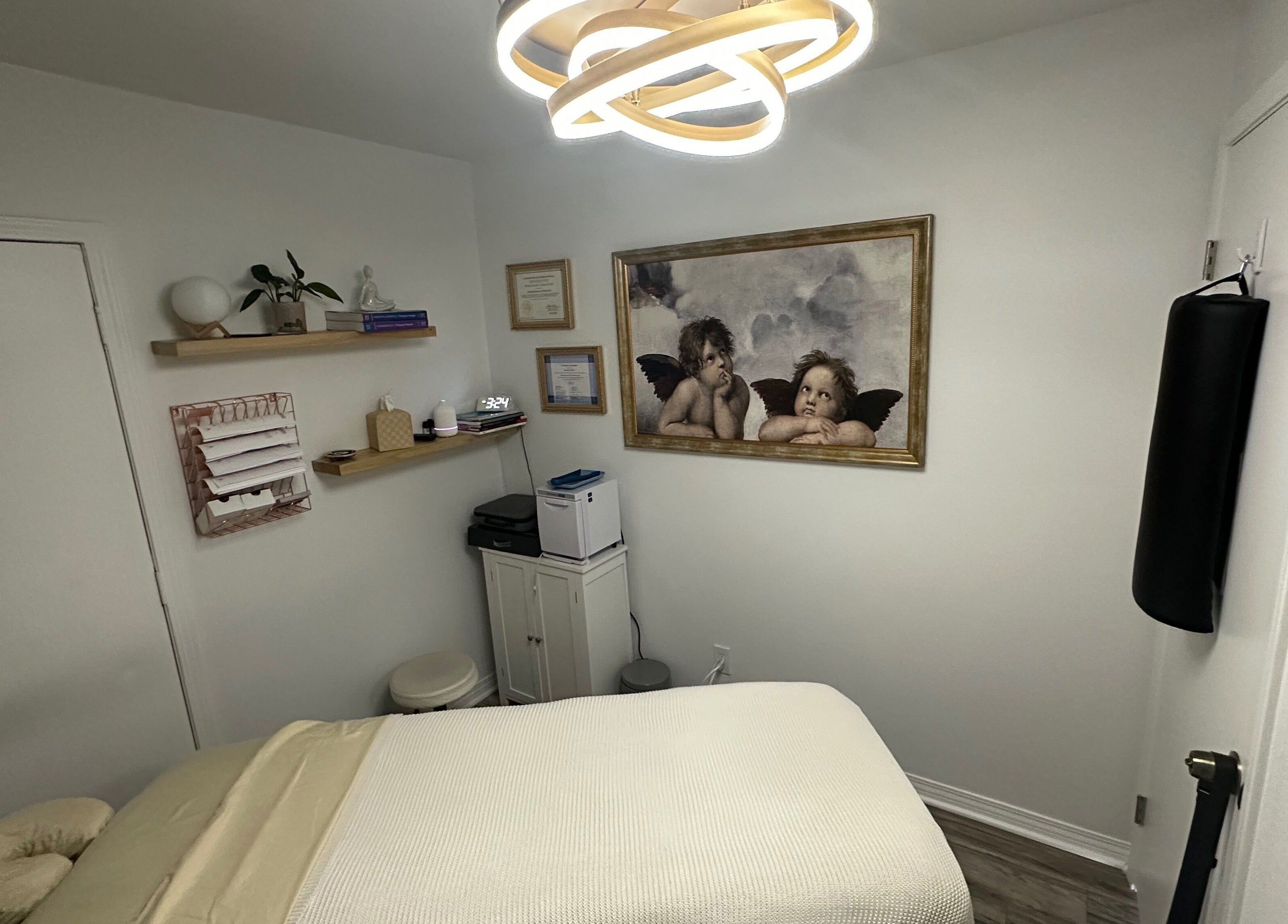 Elegant massage room at Mobility Massage by Melody in Placentia, United States, US with warm lighting and decor.