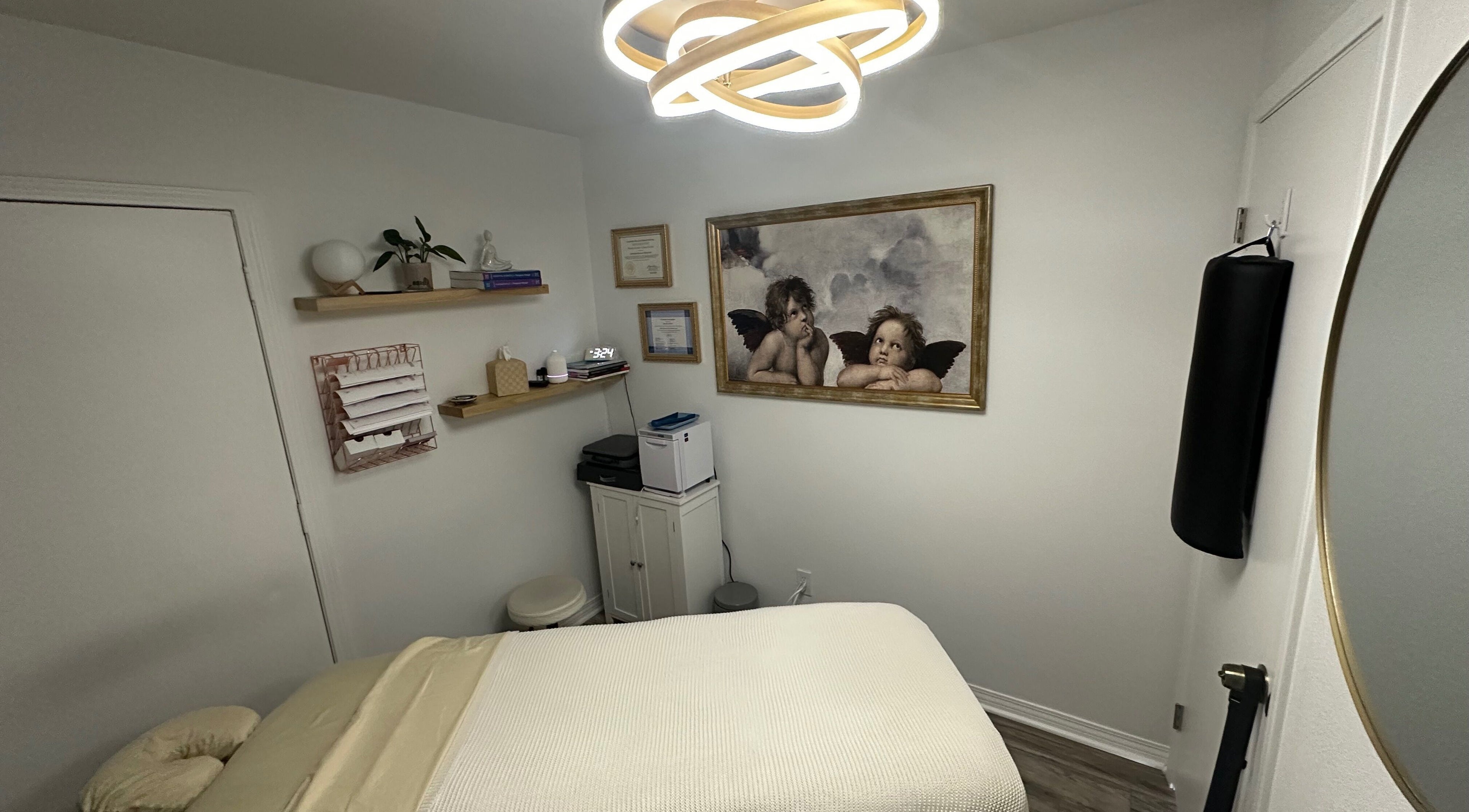 Elegant massage room at Mobility Massage by Melody in Placentia, United States, US with warm lighting and decor.