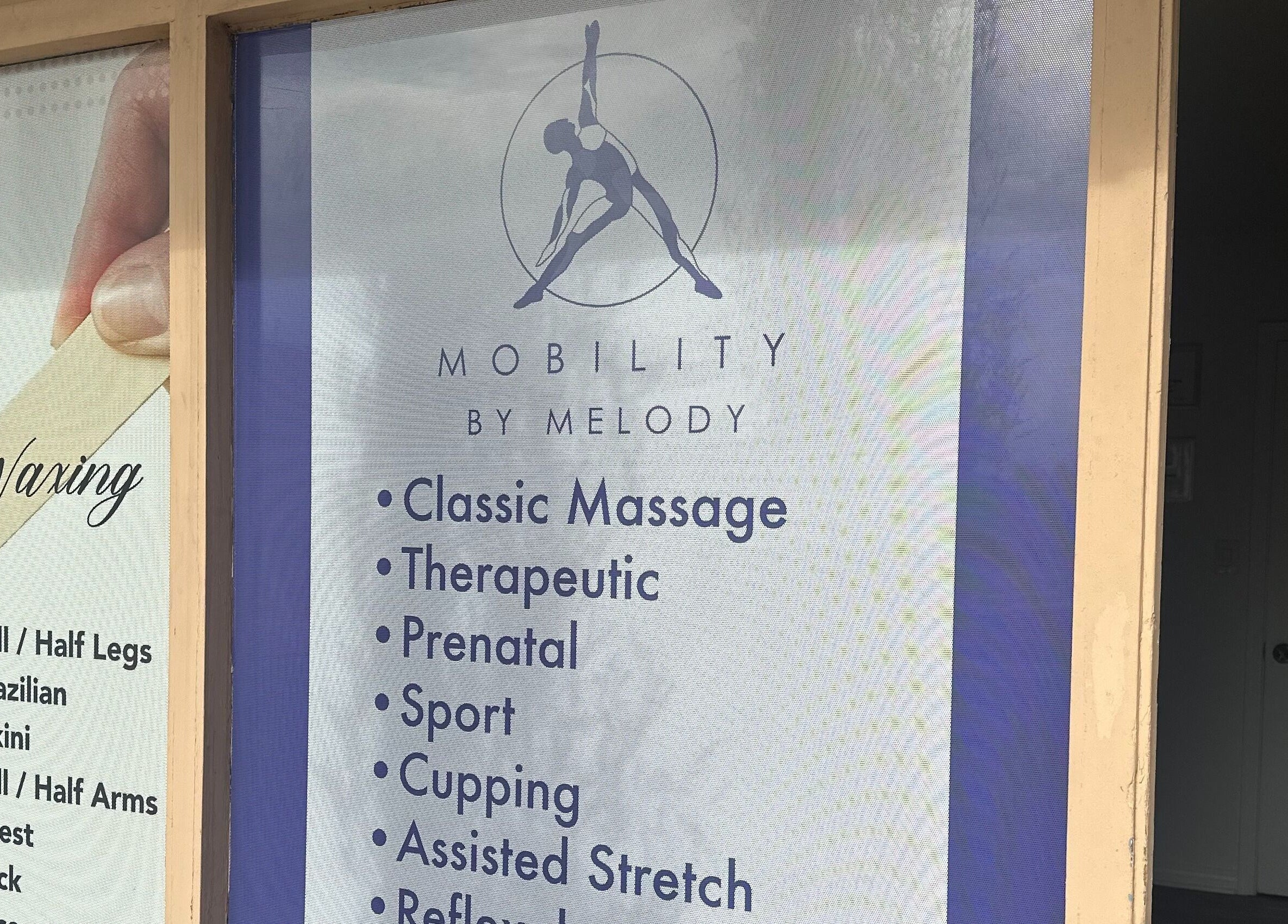 Mobility Massage by Melody signage in Placentia, US, showcasing diverse massage services offered.