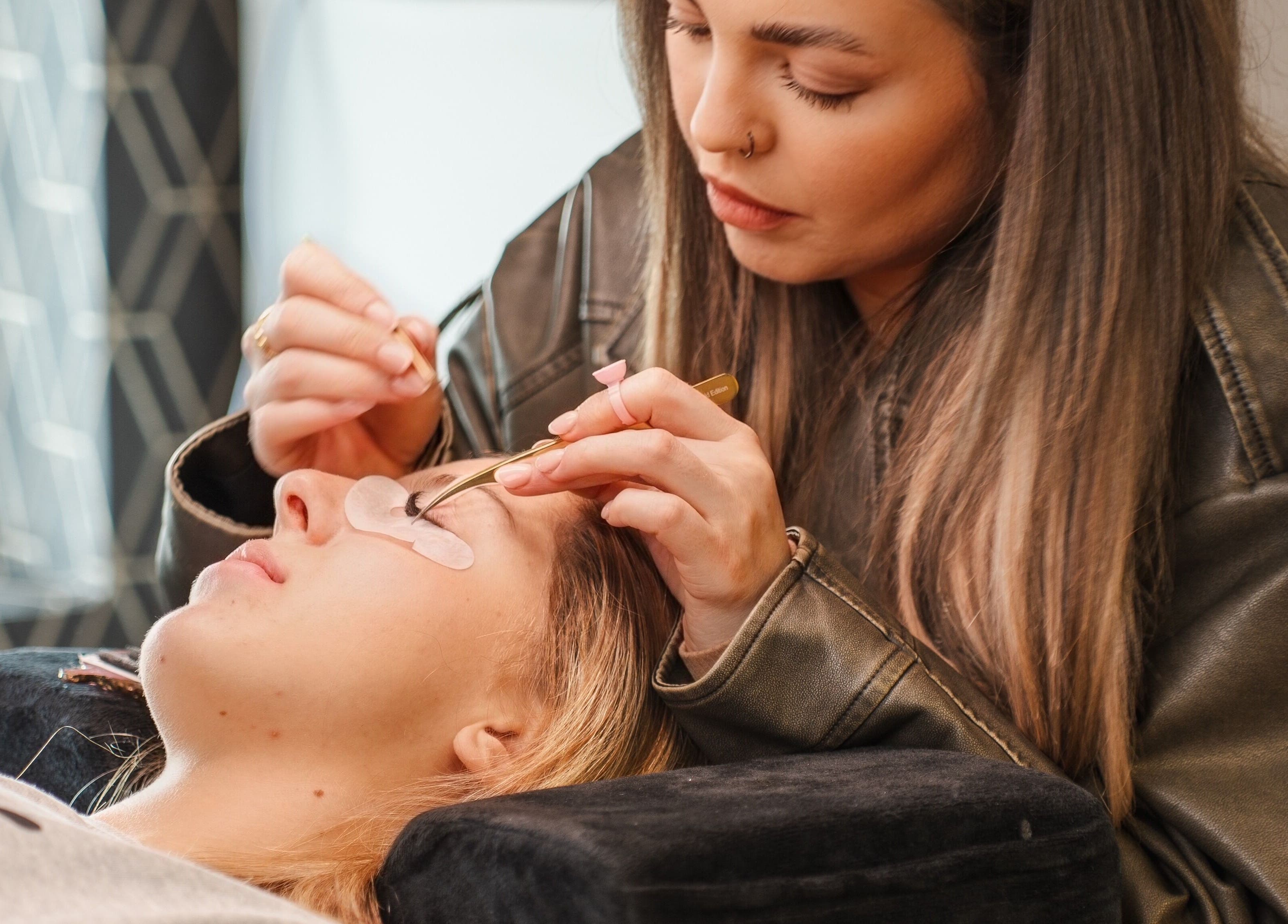Skilled beautician performing eyelash extensions at Eyeline, Gorey, County Wexford, IE.