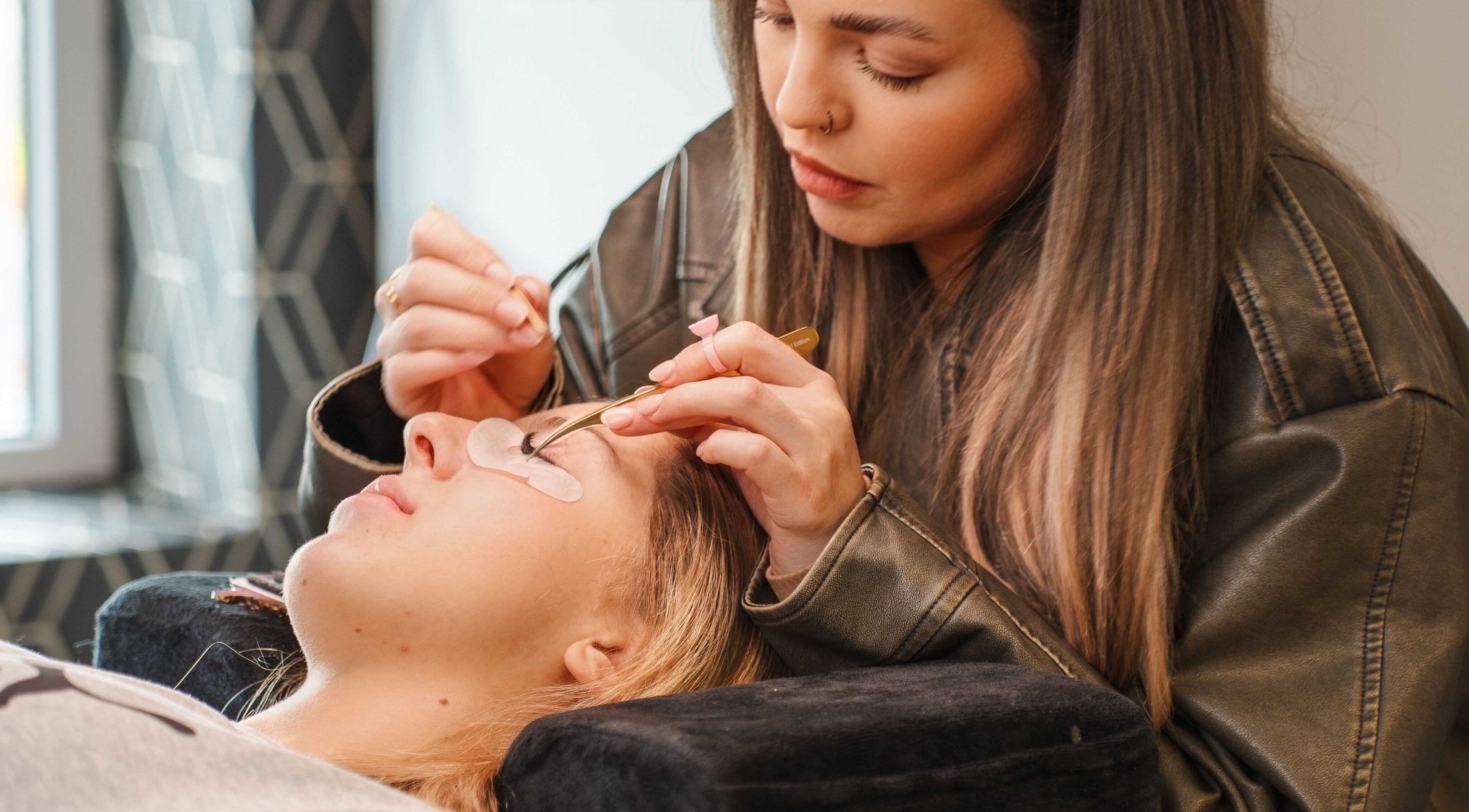 Skilled beautician performing eyelash extensions at Eyeline, Gorey, County Wexford, IE.