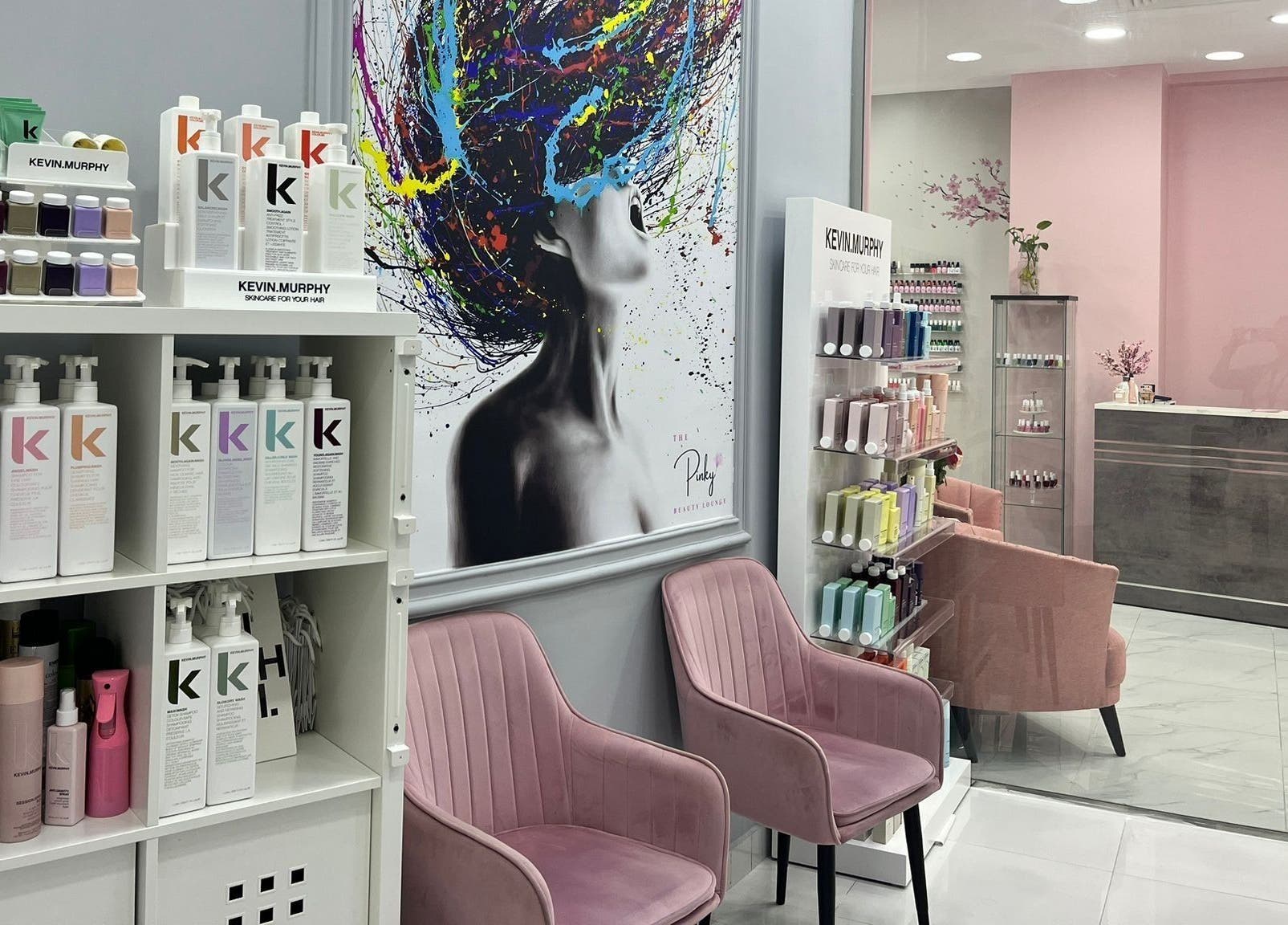 Inside The Pinky Beauty Lounge in Abu Dhabi, AE, showing stylish chairs and beauty products display.