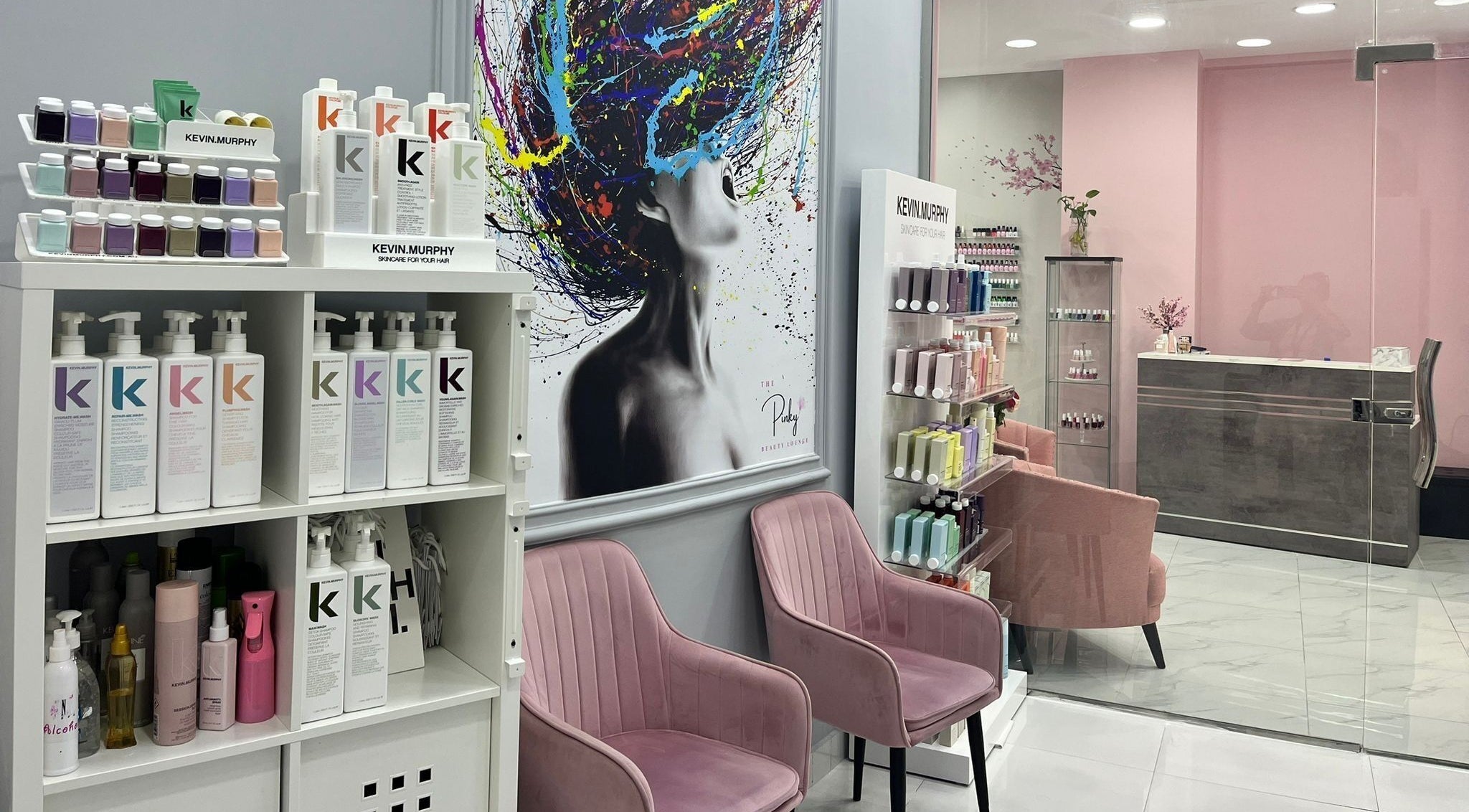 Inside The Pinky Beauty Lounge in Abu Dhabi, AE, showing stylish chairs and beauty products display.