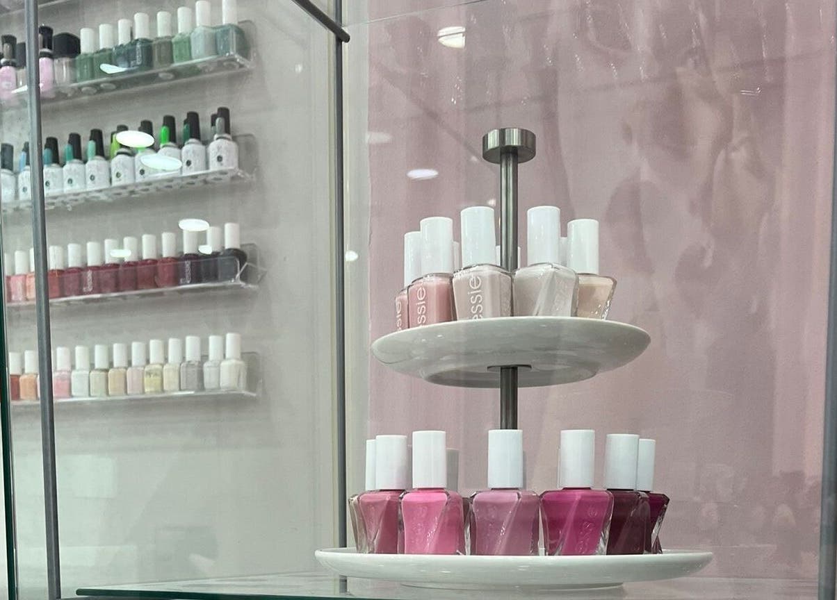 Nail polish display at The Pinky Beauty Lounge, Abu Dhabi, AE showcasing vibrant shades.