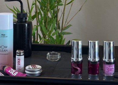 Beauty products setup at 24K Beauty Studio, Noord, AW featuring toner and cosmetics.