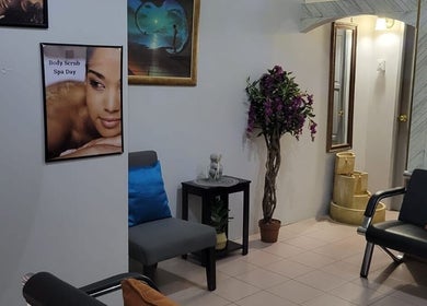 Relaxing waiting area at L'Image Parfaite Day Spa, Port of Spain, TT with cozy chairs and decor.