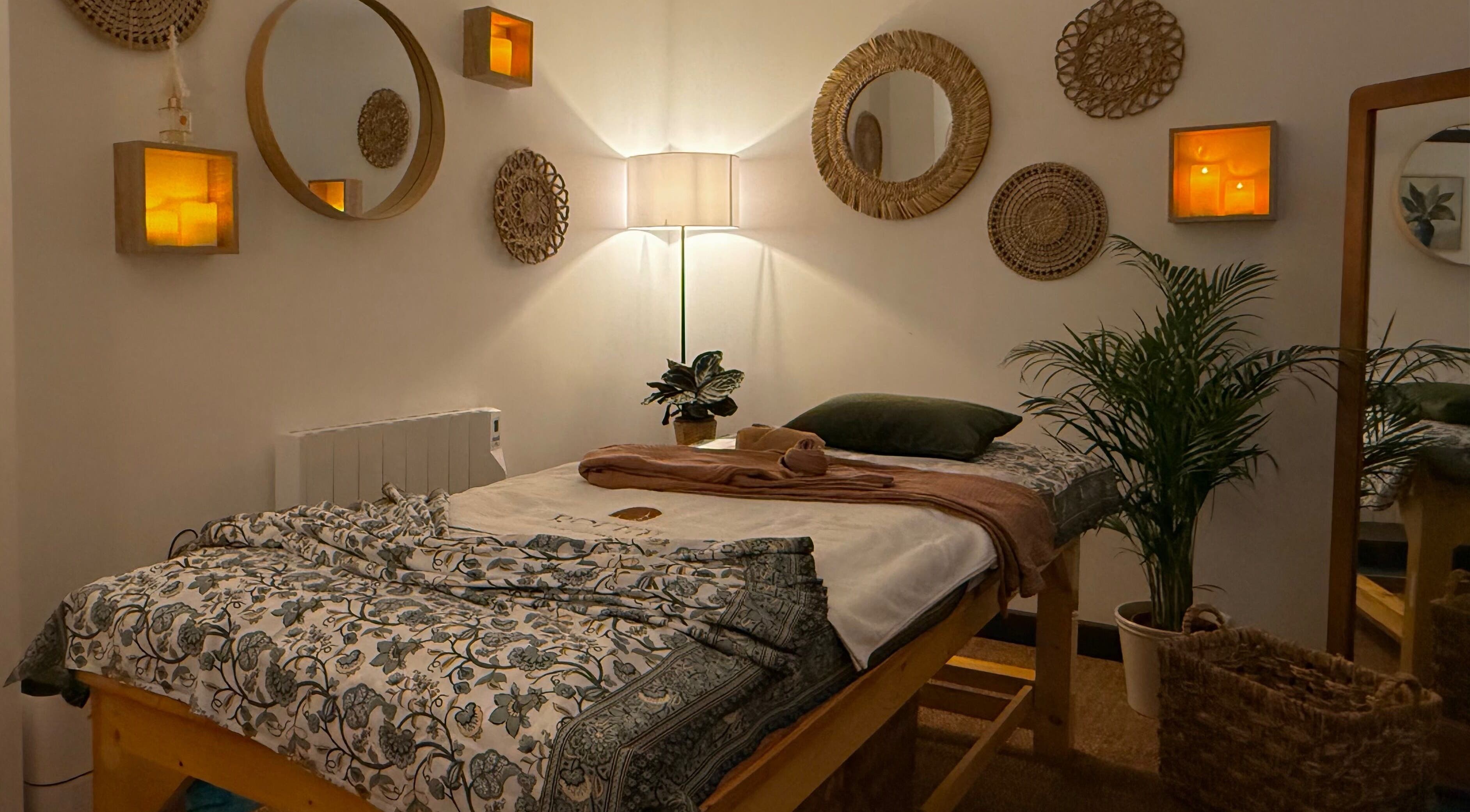 Calming massage room at Roukh Thai Wellness, Halifax, England, GB with soft lighting and elegant decor.