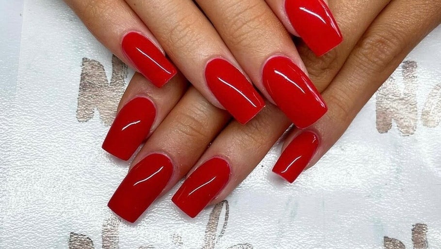 Vibrant red manicure at Nails By Sheridan, Bucasia, Queensland, AU showcasing glossy nail art.
