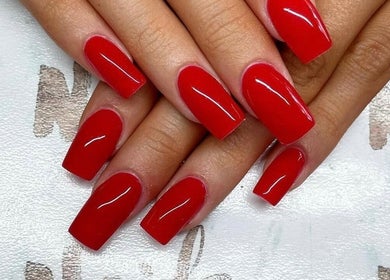Vibrant red manicure at Nails By Sheridan, Bucasia, Queensland, AU showcasing glossy nail art.