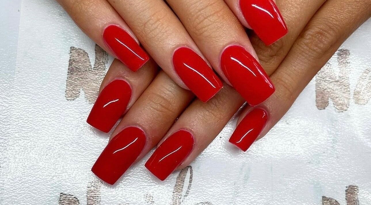 Vibrant red manicure at Nails By Sheridan, Bucasia, Queensland, AU showcasing glossy nail art.