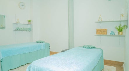 Relaxing spa treatment room at Chilax in DARWIN CITY, Northern Territory, AU with two massage tables.