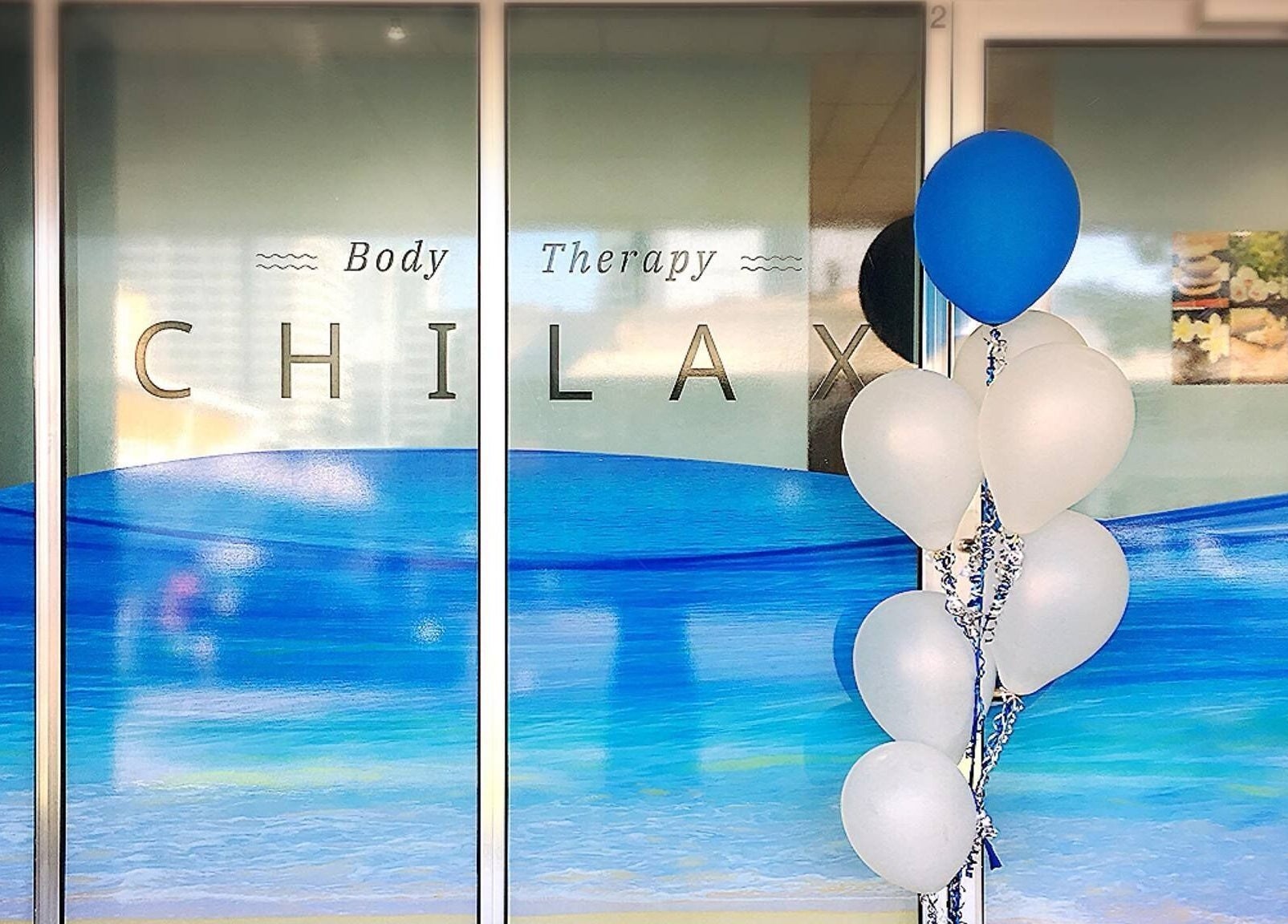 Chilax entrance in DARWIN CITY, Northern Territory, AU, featuring blue and white decor with balloons.
