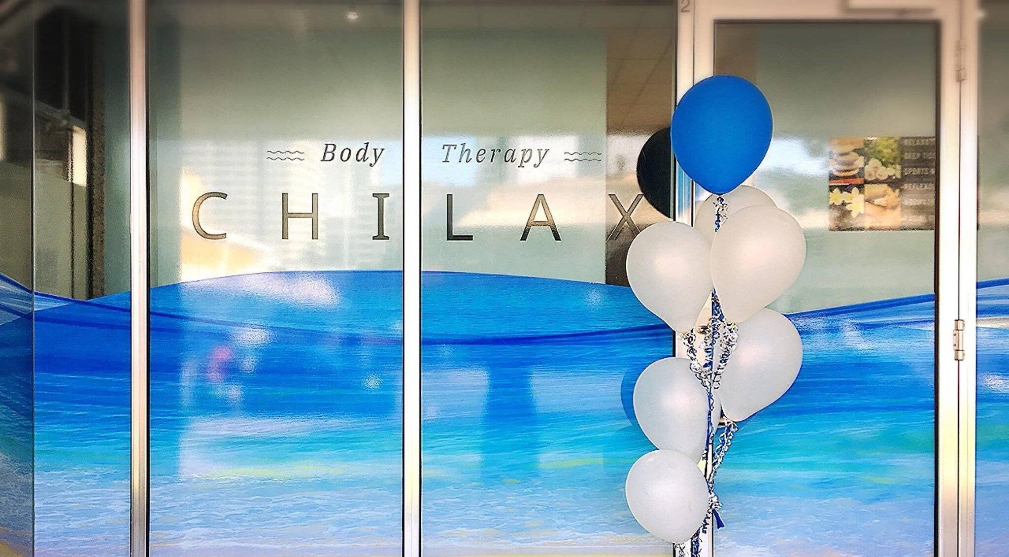 Chilax entrance in DARWIN CITY, Northern Territory, AU, featuring blue and white decor with balloons.