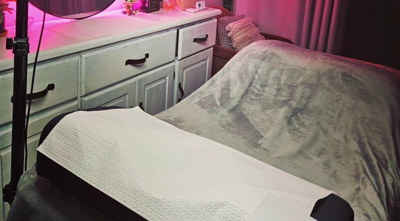 Cozy massage bed setup at Beauty by Nikki, Wallan, Victoria, AU, with ambient lighting and elegant decor.