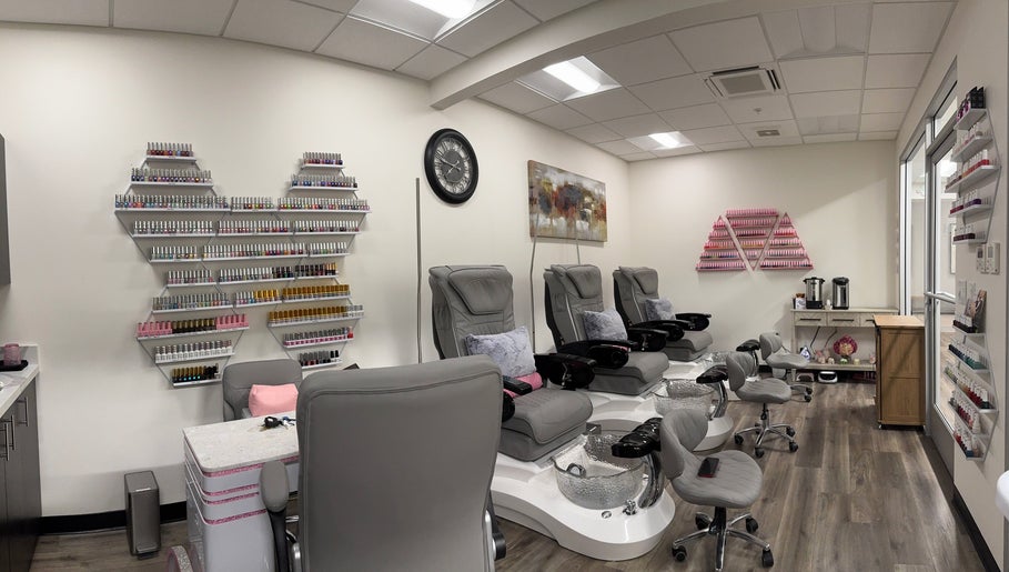 Elegant pedicure chairs and nail polish displays at Studio 8 Nail Bar in San Jose, California, US.