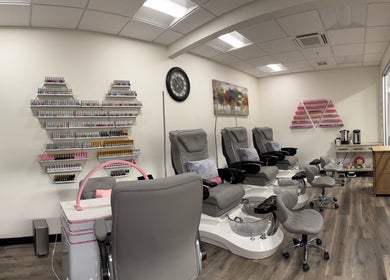 Inside Studio 8 Nail Bar in San Jose, California, showcasing chic manicure stations and nail polish collections.