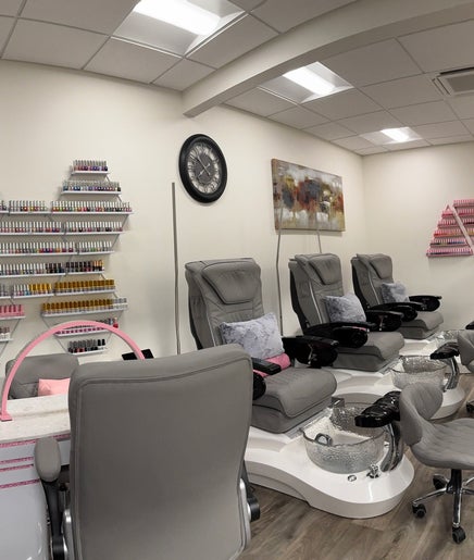 Inside Studio 8 Nail Bar in San Jose, California, showcasing chic manicure stations and nail polish collections.