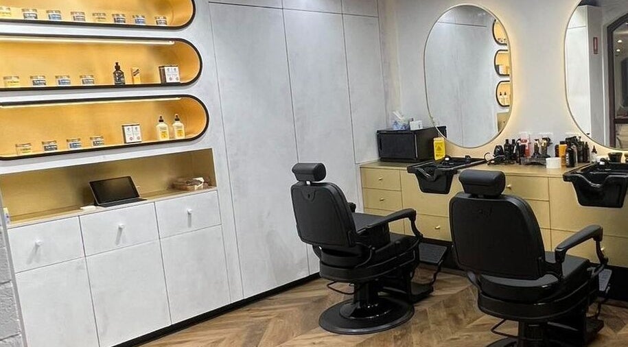 Sophisticated barber chairs at Quintessential Man in Redfern, New South Wales, AU, reflecting modern grooming style.