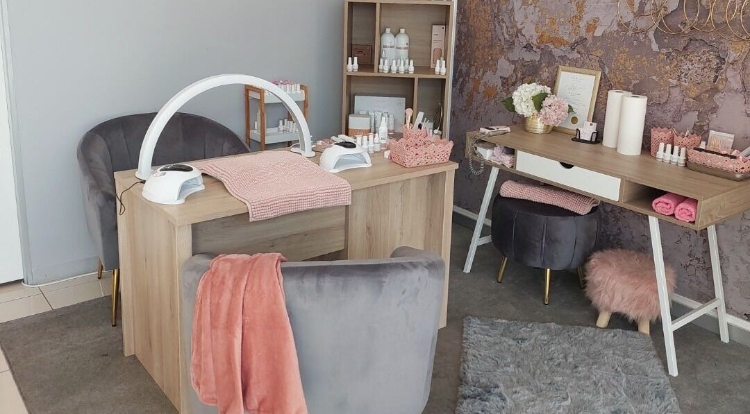 Chic manicure station at Lilly-mai Nails, Westville, Kwazulu-natal, ZA, with plush seating and elegant decor.