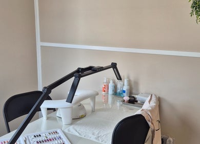 Nail care station at Fingers and Toes, Mexborough, England, GB with manicure tools and products.