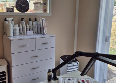 Modern interior of Fingers and Toes in Mexborough, England, GB with beauty products on display.