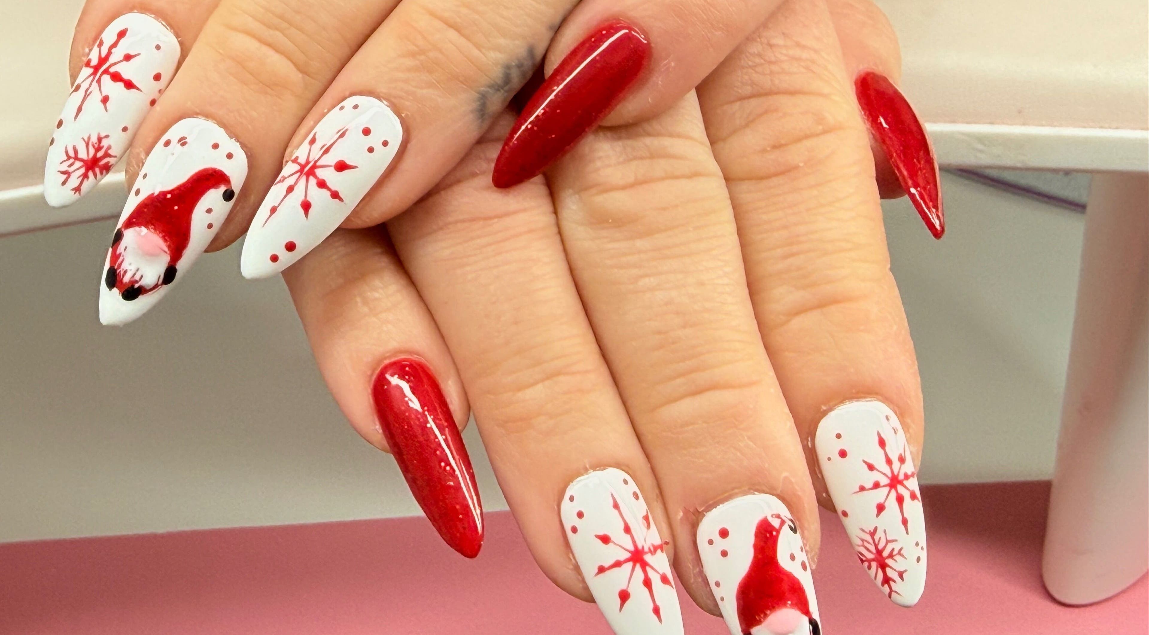 Festive red and white Christmas nail art by Nails by Emma in Norton, England, GB showcasing holiday spirit.