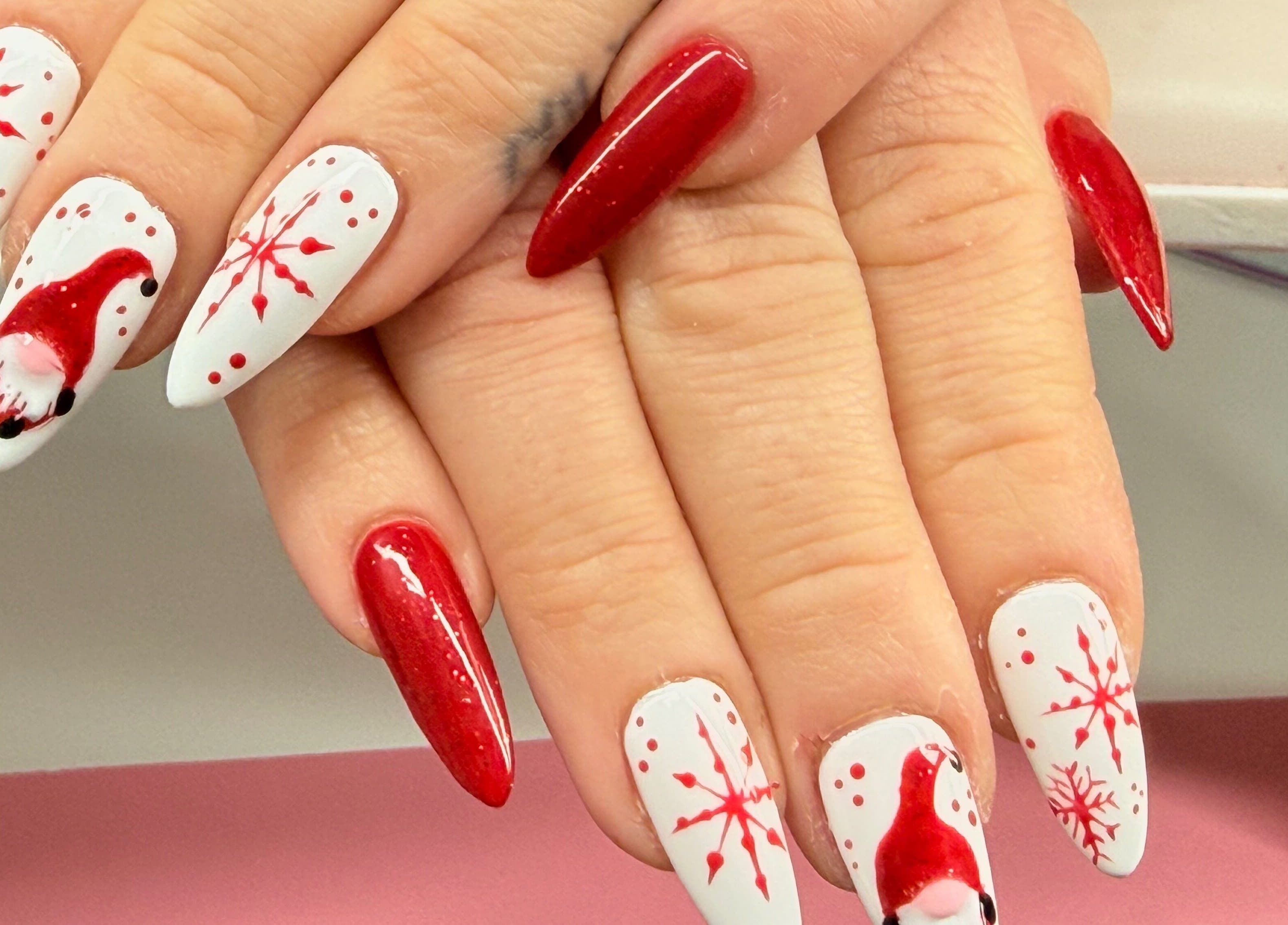 Festive nail art with red and white Santa design at Nails by Emma, Norton, England, GB.