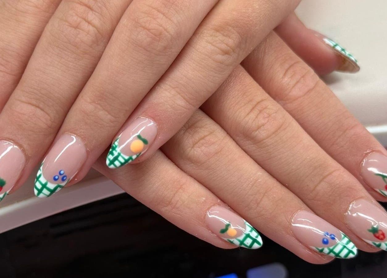 Creative fruit-themed nail art at Nails by Emma, Norton, England, GB. Vibrant, stylish manicure design.