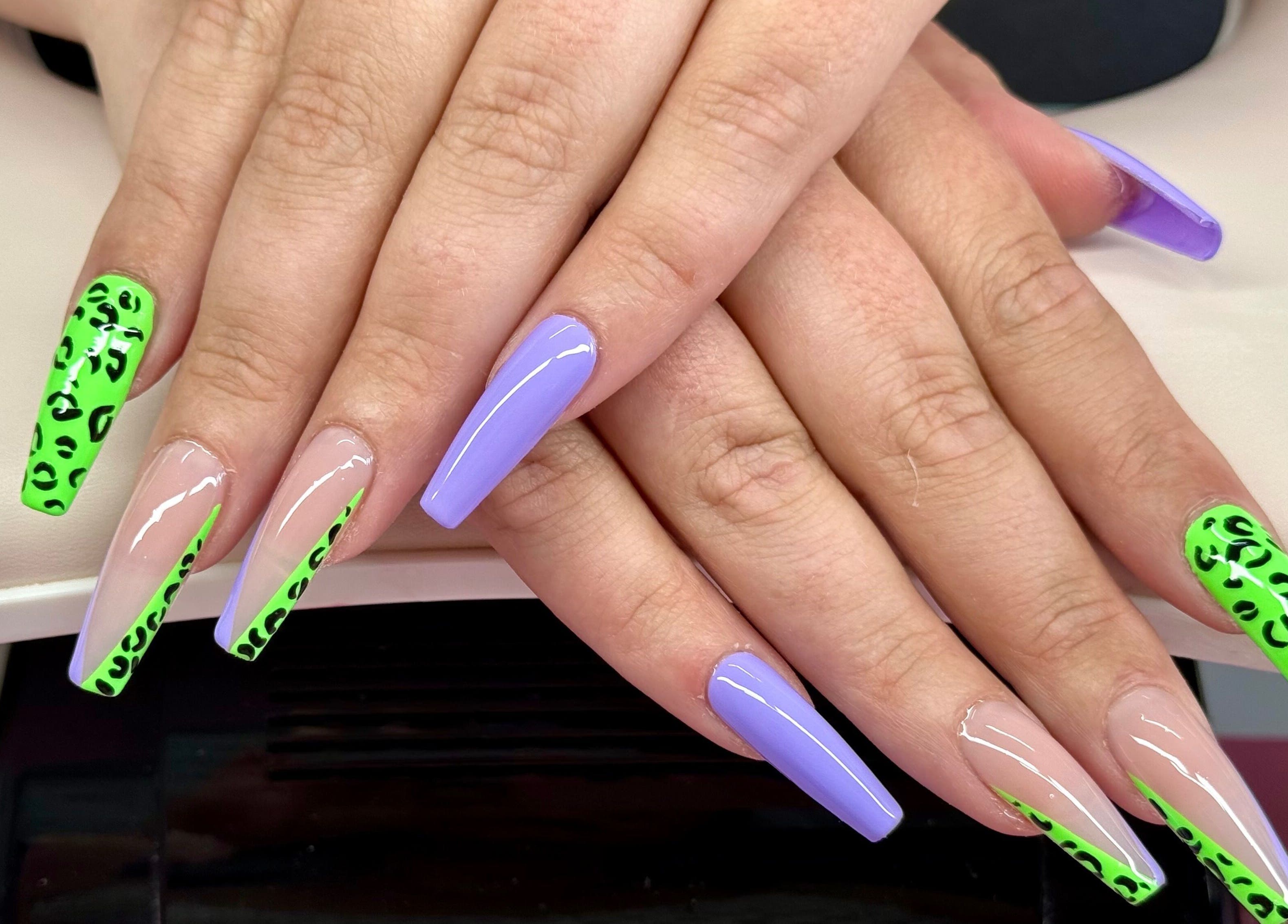 Bright purple and green leopard print nail design at Nails by Emma, Norton, England, GB.