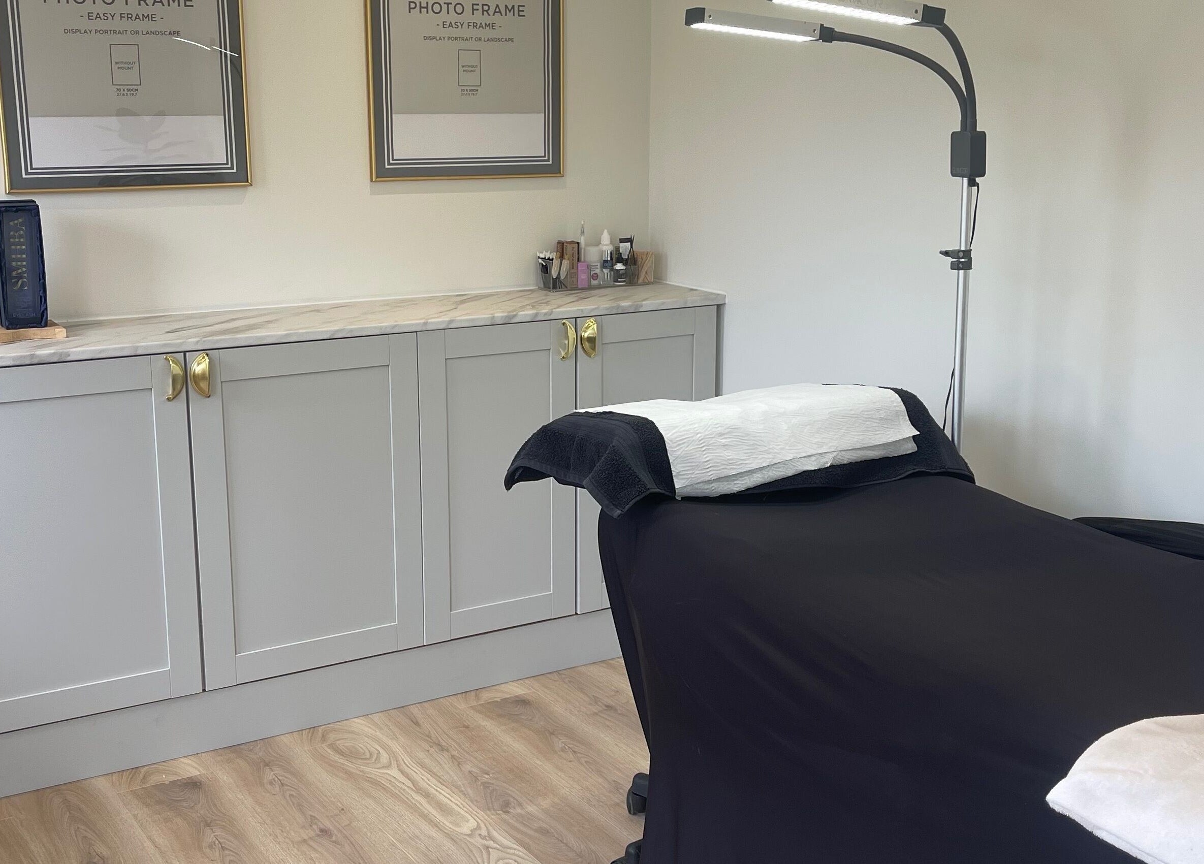 Tranquil treatment room at No. 1 Beauty, Whitfield, England, GB, featuring a massage bed and elegant decor.