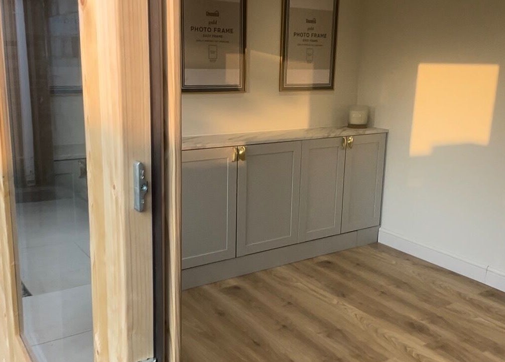 Elegant treatment room at No. 1 Beauty in Whitfield, England, GB, with wooden flooring and ambient lighting.